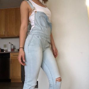 Ripped jean overalls